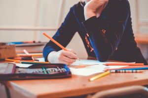 Woman writing on a desk