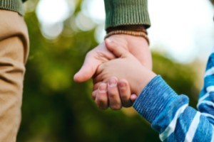 Child holding a hand